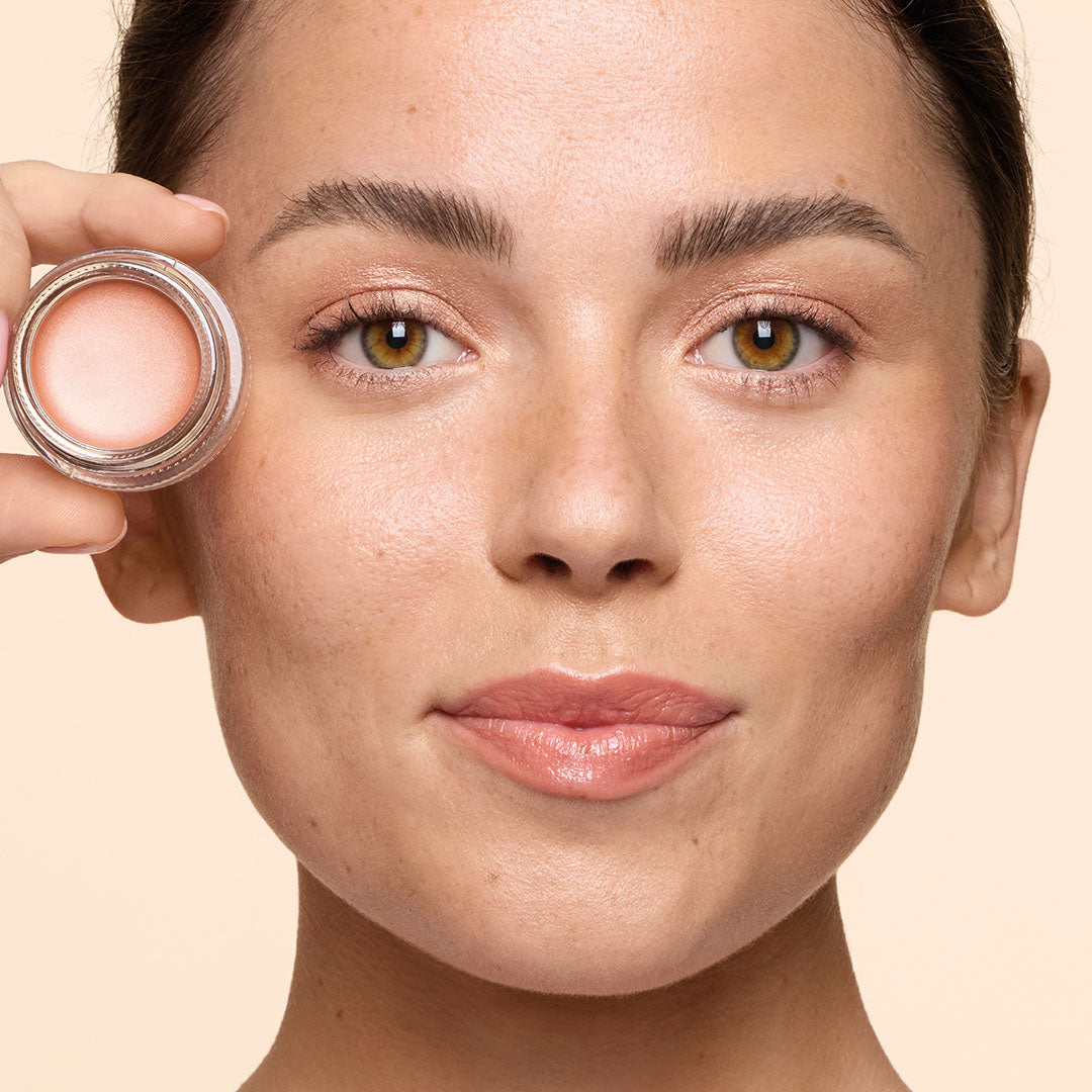 Three tubes of HICKAP priming moisturizer in different shades held in hand.